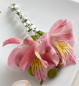 The FTD Pink Peruvian Lily Boutonniere