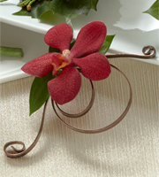 The FTD Red Mokara Boutonniere